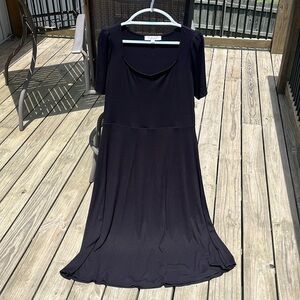 Black ribbed cotton ankle-length dress. Short, ruched blouse sleeves. New.